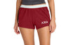 Person wearing red shorts with a logo on a white background