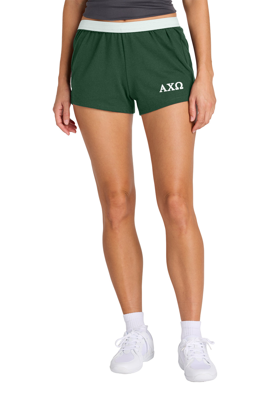 Person wearing red shorts with a logo on a white background
