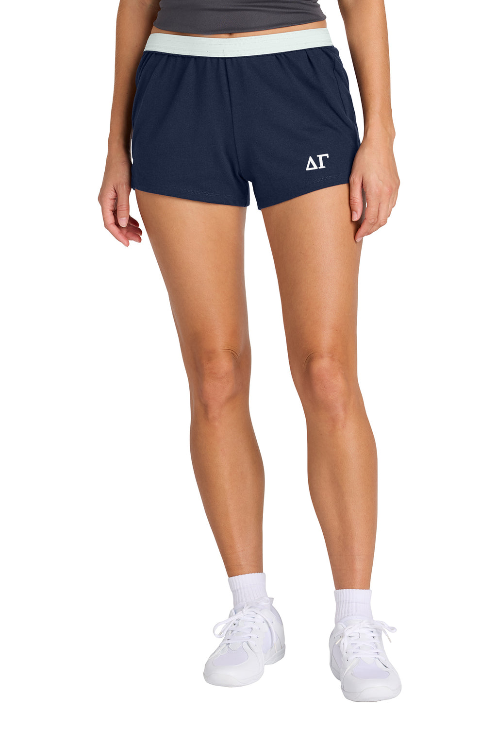 Person wearing pink shorts with a logo on a white background