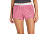 Person wearing pink shorts with a logo on a white background
