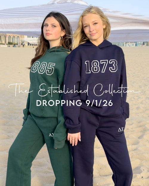 Navy heavyweight fleece hoodie with large vintage varsity-style numbers on the chest.  