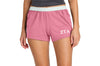 Person wearing pink shorts with 'ZTA' logo on a white background