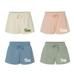 Four pairs of shorts in different colors with color names printed on them.