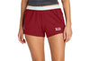 Person wearing red shorts with a logo on a white background